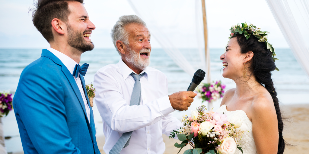 The officiant at a wedding provides a little comic relief to the nervous couple.