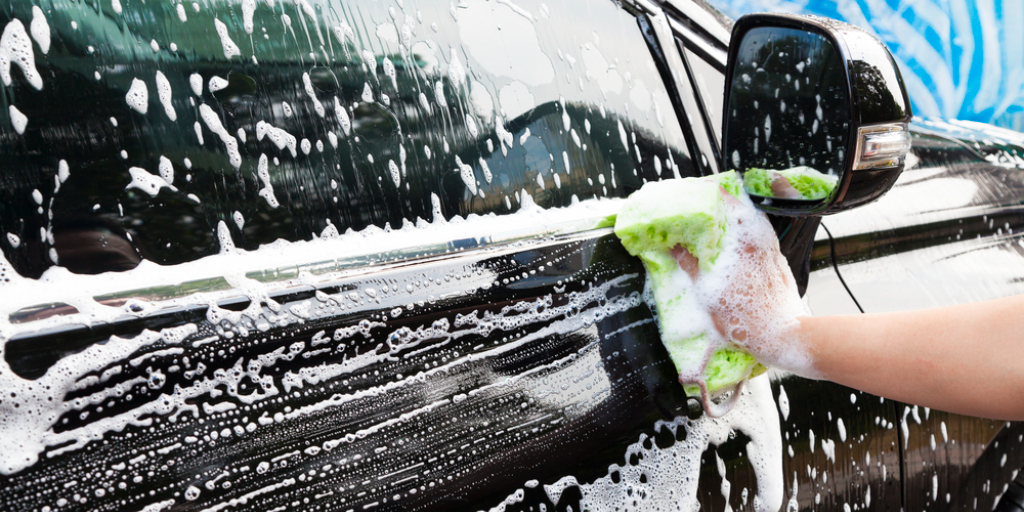 Close-up view of a car being washed