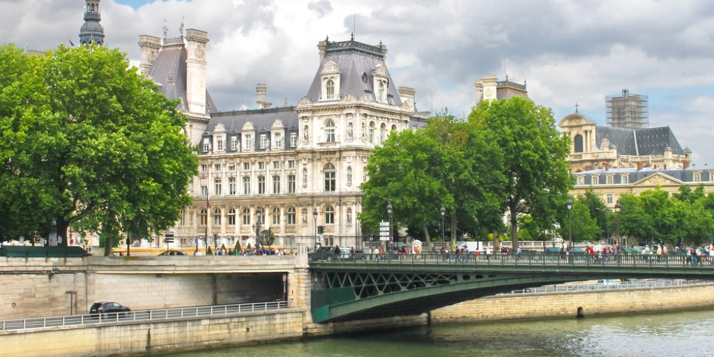 A historic building and a bridge in Paris