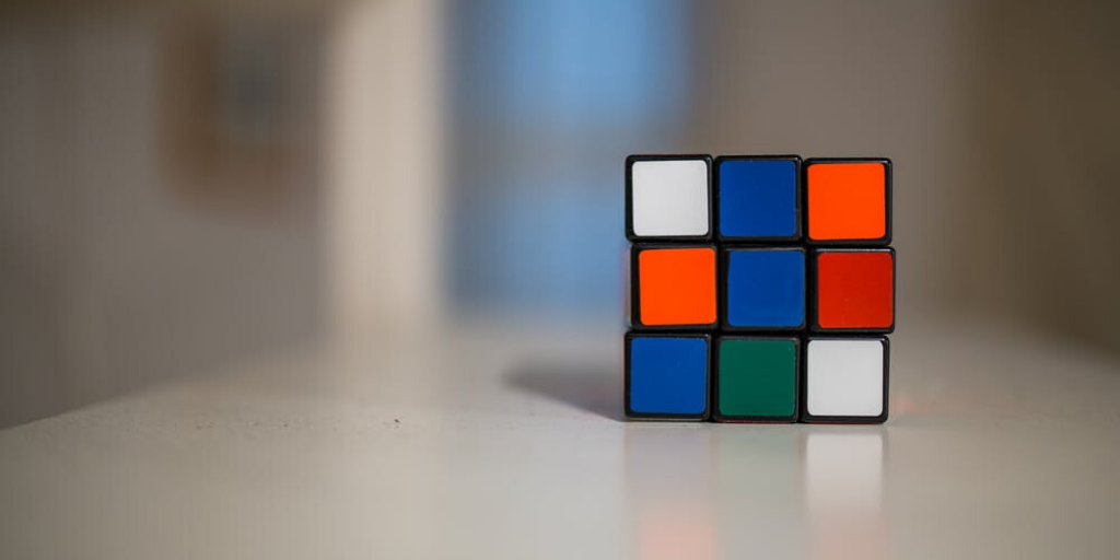 A Rubik's cube in an unsolved position on a table