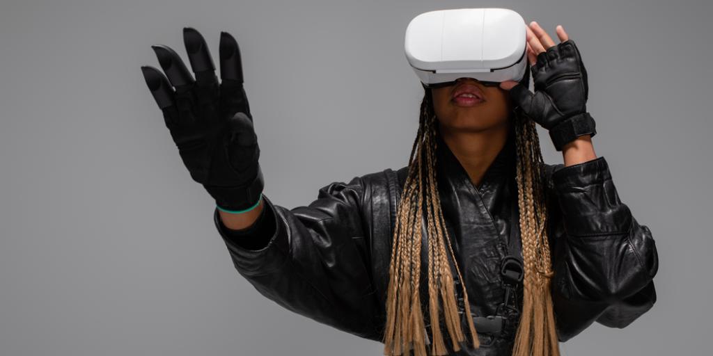 A woman is wearing virtual reality goggles. You have our permission to write off the metaverse.
