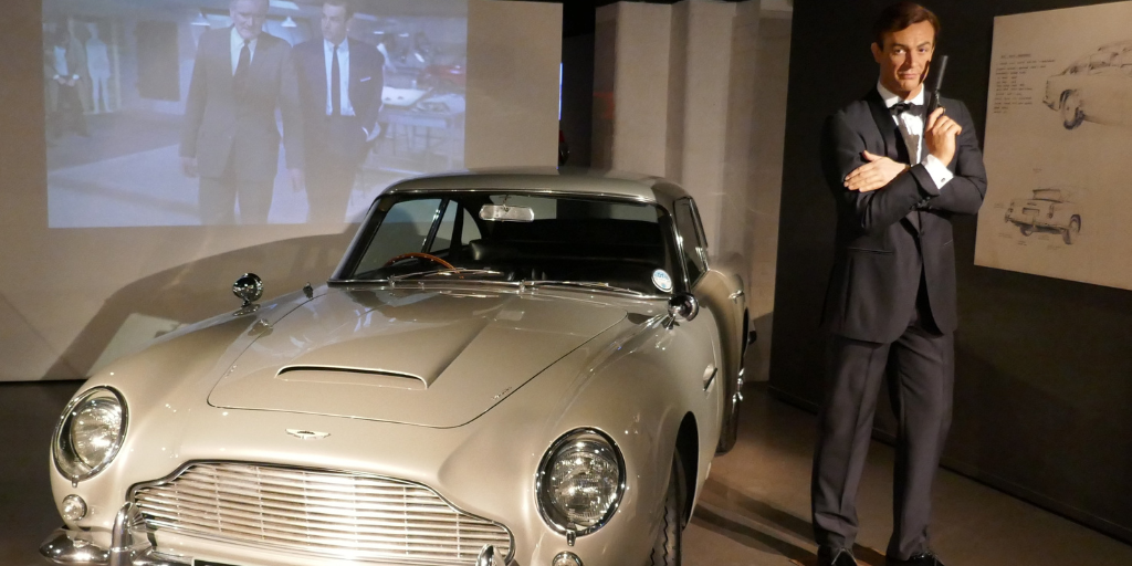 A model of Bond actor Sean Connery next to an Aston Martin DB5 at the London Film Museum