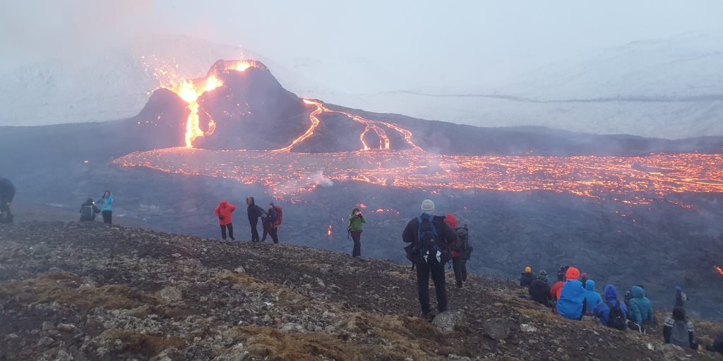 People on the slopes of Fagradalsfjall watching the Geldingadalir eruption 2021