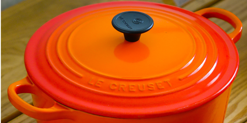A Le Creuset pot with a lid in Volcanique