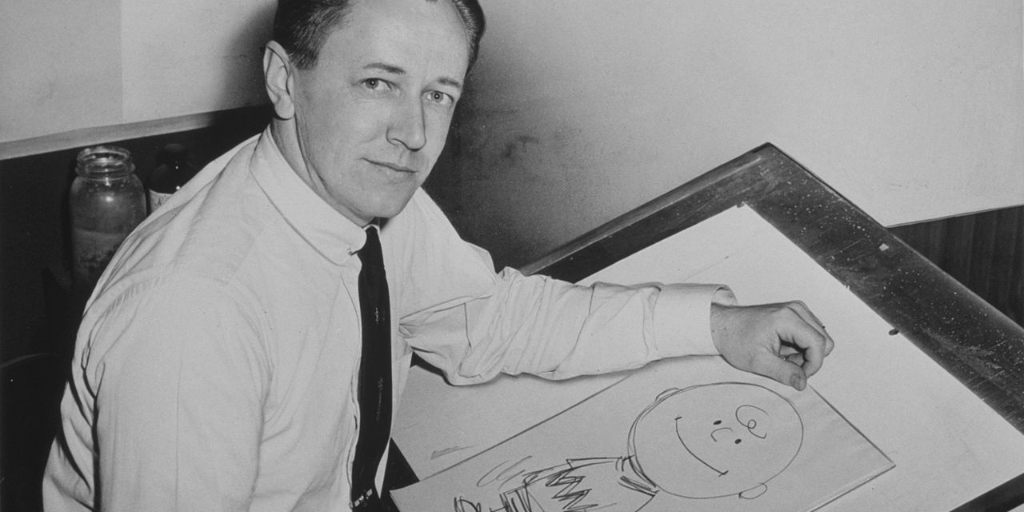 Charles Schulz drawing one of the early cartoons in 1956.