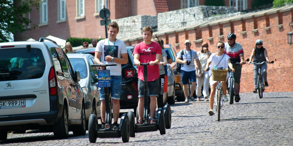 Tourists ride discontinued Segway scooters