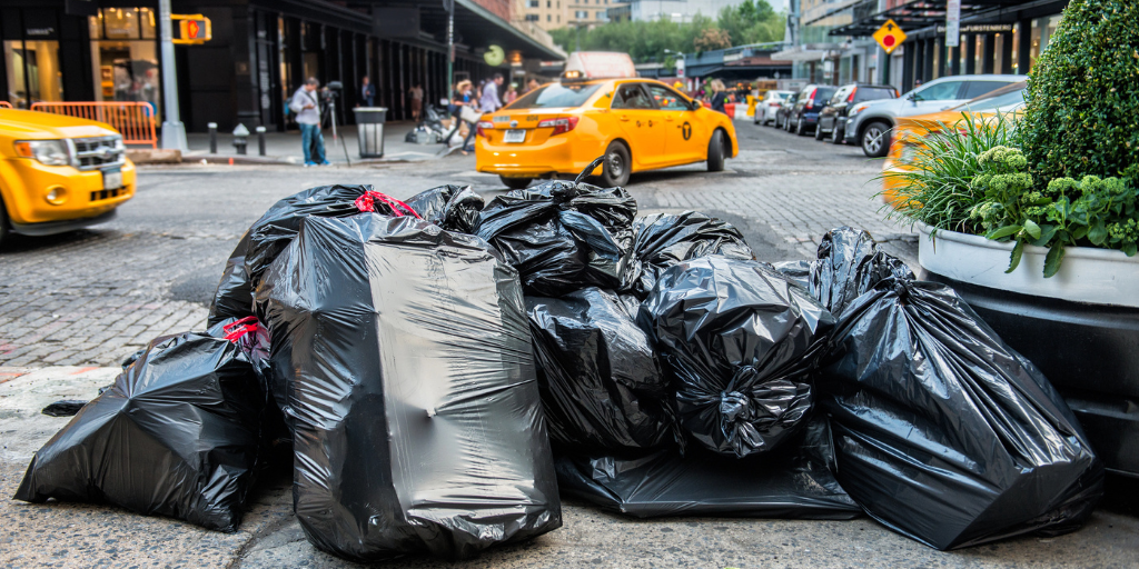 A close up of trash bags on the streets of New York